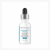 A bottle of SkinCeuticals Discoloration Defense serum with a dropper cap.