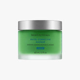 A green jar of SkinCeuticals Phyto Corrective Masque , which is a calming botanical face mask.