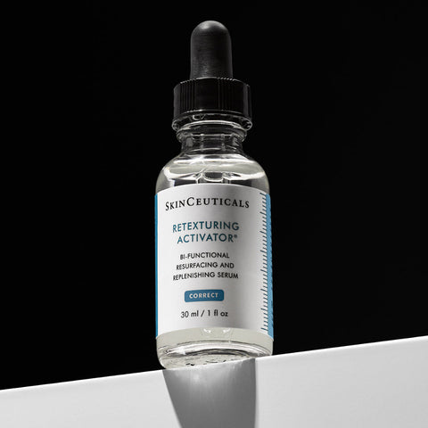 SkinCeuticals Retexturing Activator serum bottle on a black and white background