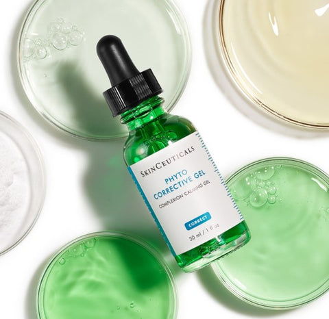 Green skincare serum bottle with dropper on a white background