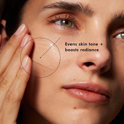 Close-up of a person's face with text indicating skin care product benefits.