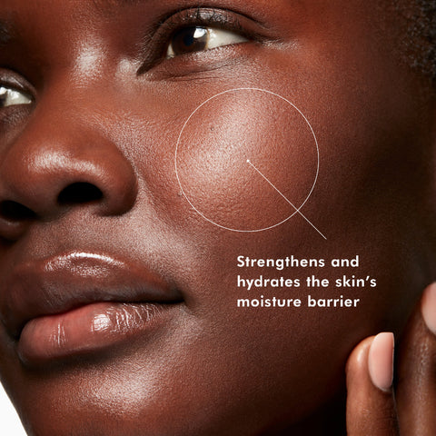 Close-up of a woman's face highlighting her cheek with a white circular outline and text that reads 'Strengthens and hydrates the skin's moisture barrier'.