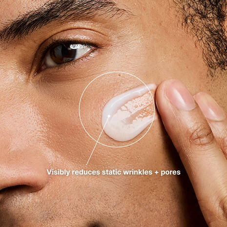 Close-up of a person applying SkinCeuticals P-TIOX Cream to their face with text indicating skin care benefits.