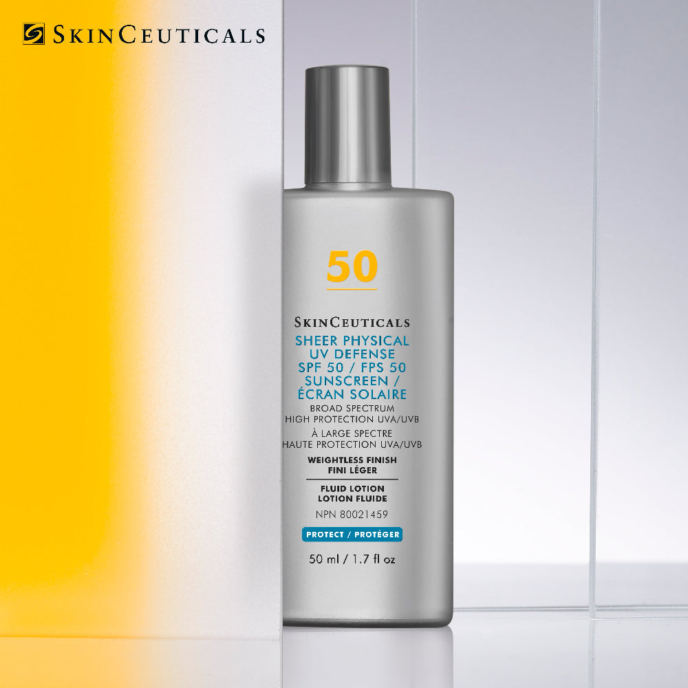 A bottle of SkinCeuticals Sheer Physical UV Defense SPF 50 sunscreen, shown against a split white and light gray background with a yellow gradient on the left. The product packaging is metallic silver with black and blue text.