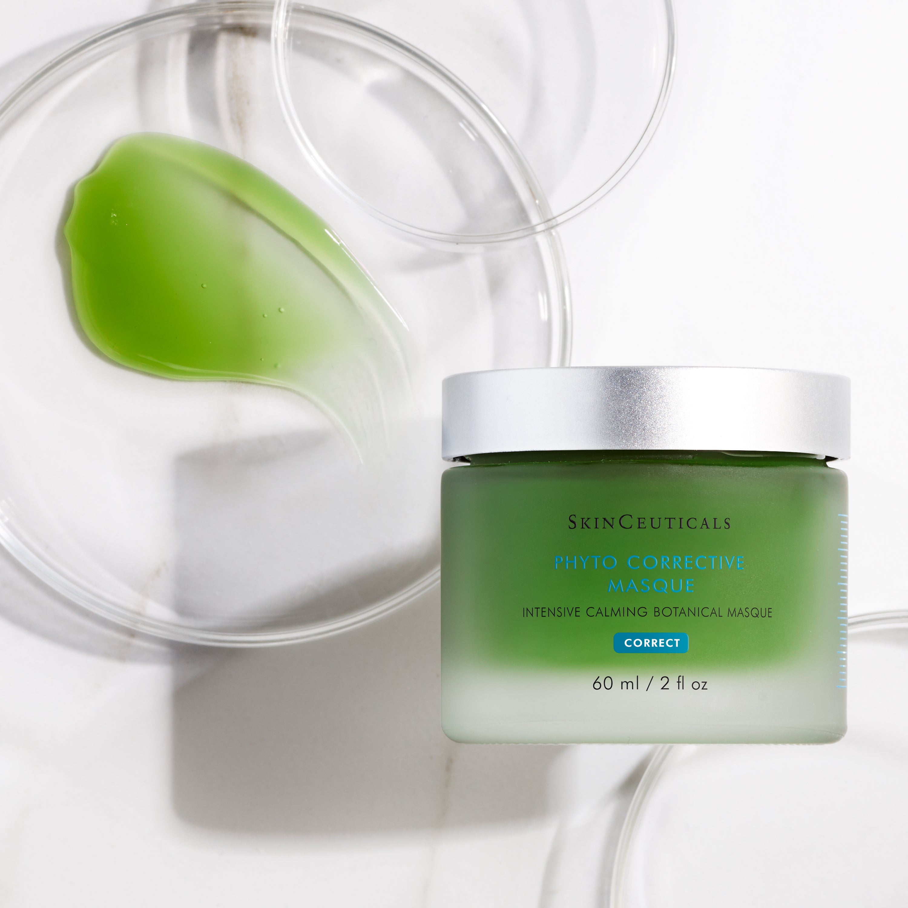 Green SkinCeuticals Phyto Corrective Masque jar with a clear lid on a white background