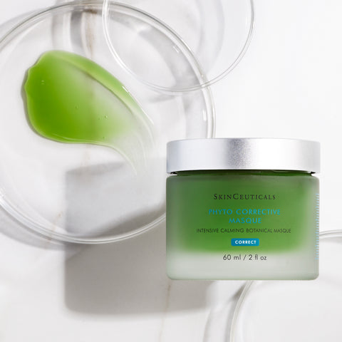 Green SkinCeuticals Phyto Corrective Masque jar with a clear lid on a white background