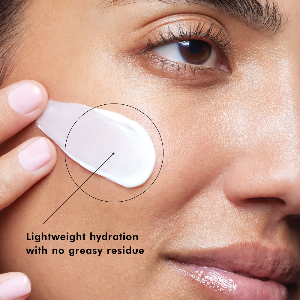 Close-up of a woman applying SkinCeuticals Daily Moisture to her face with text 'Lightweight hydration with no greasy residue'.
