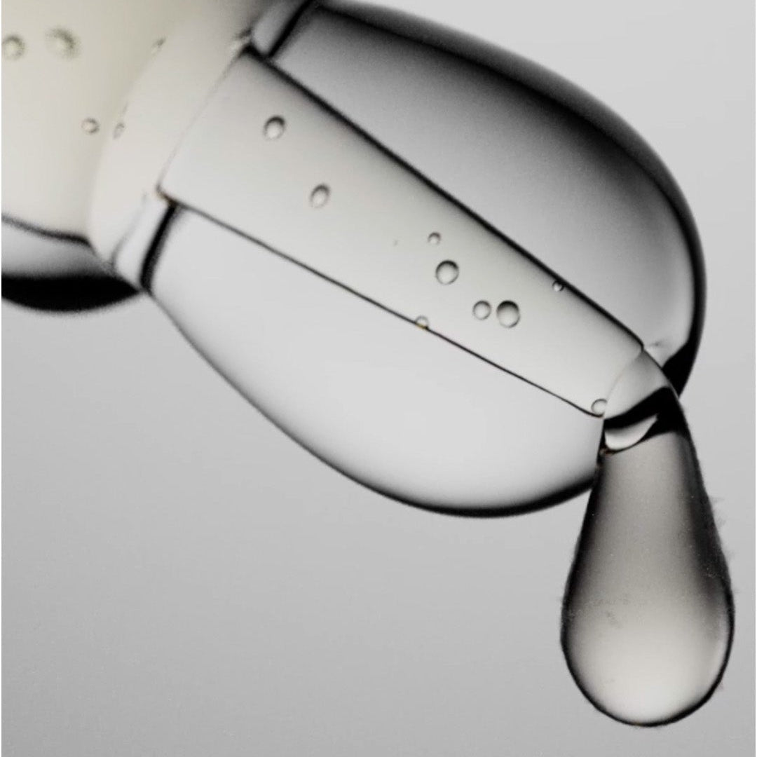 A close-up studio shot of ZO Skin Health Complexion Clarifying dripping from a dropper.