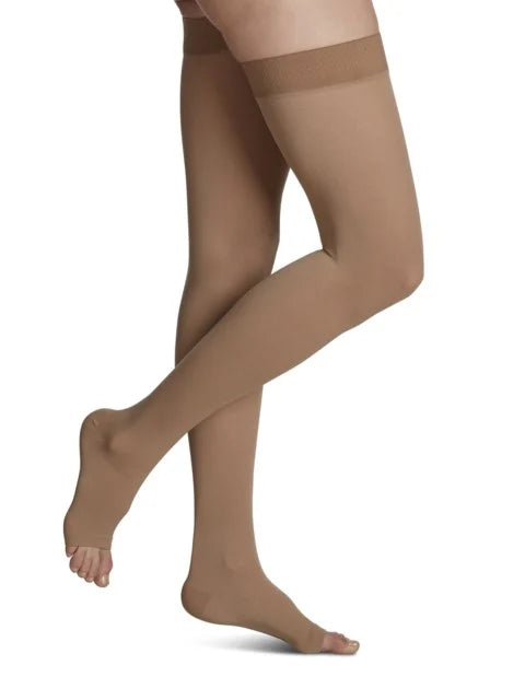 Light Beige sheer stockings worn by a person on a white background