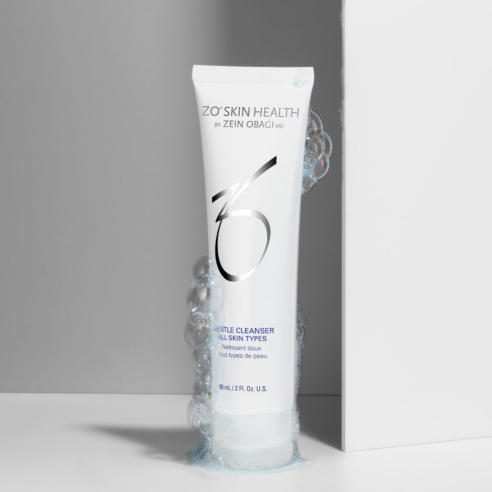 ZO Skin Health Gentle Cleanser tube with bubbles on a gray background